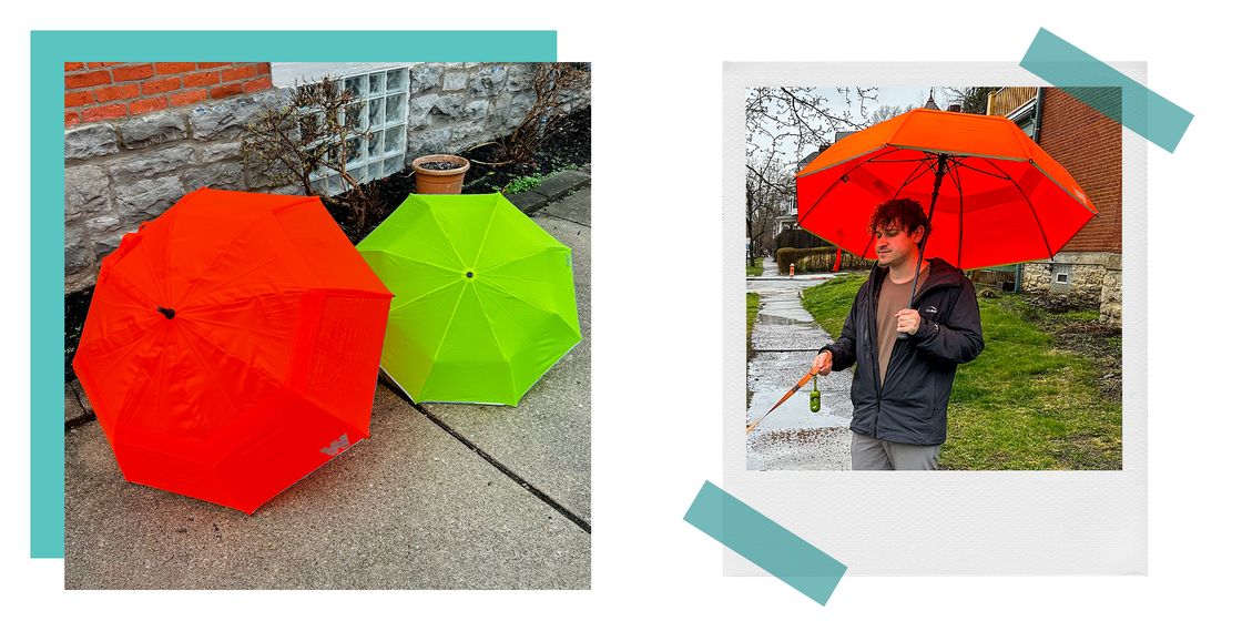 weatherman travel umbrellas open on the sidewalk together, and brnadon using an orange weatherman travel umberlla outside in the rain