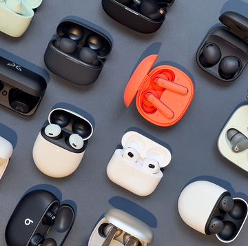 collection of wireless earbuds in charging cases